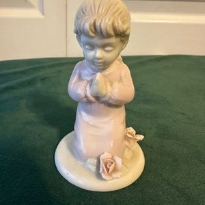 Praying child, porcelain figurine.